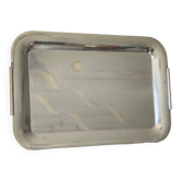 Vintage stainless steel serving platter with marine decor and golden handles.