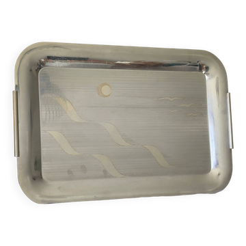 Vintage stainless steel serving platter with marine decor and golden handles.