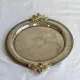 Vintage silver-plated serving tray with bow handles.