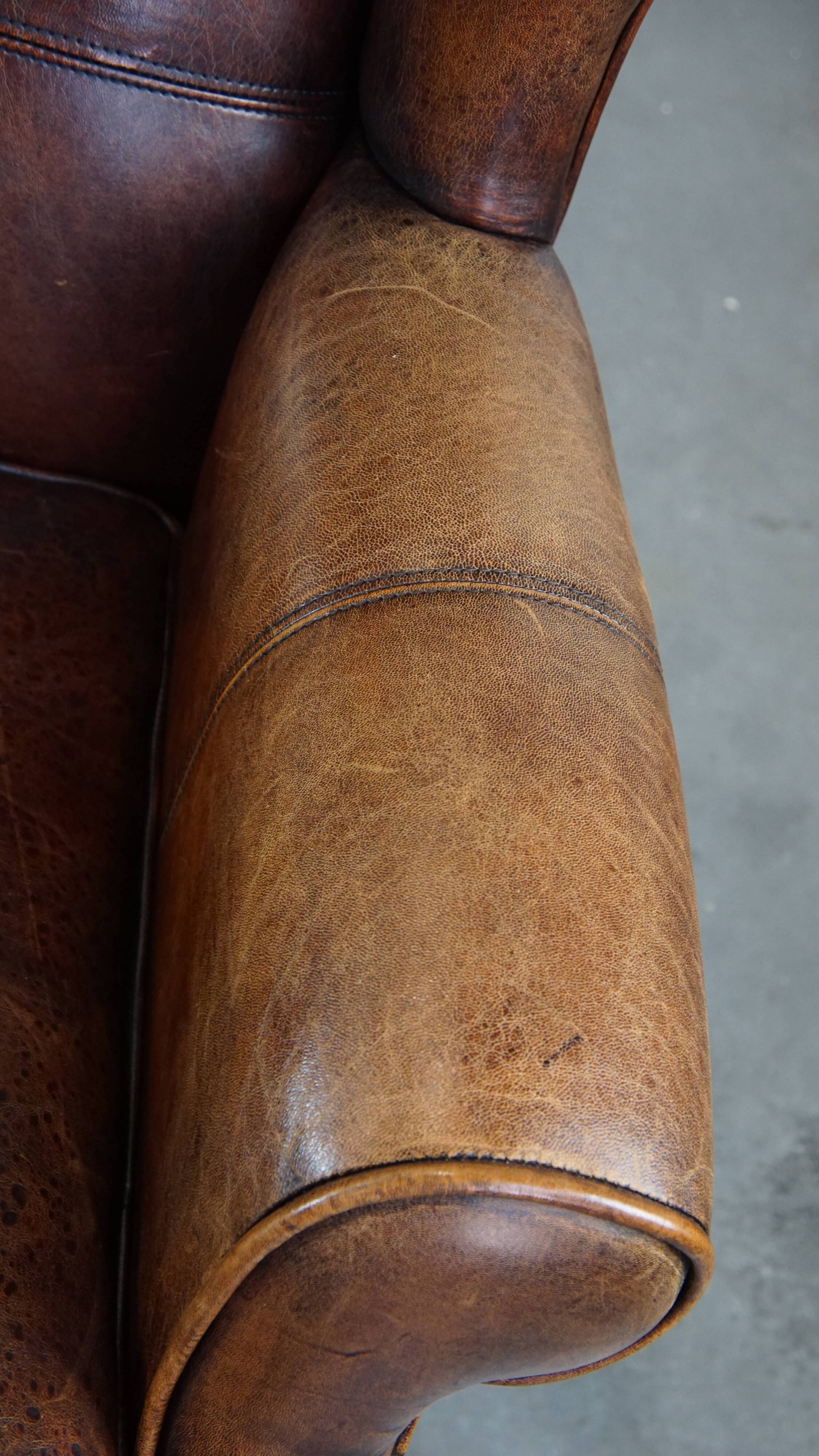 Fauteuil à oreilles en cuir de mouton