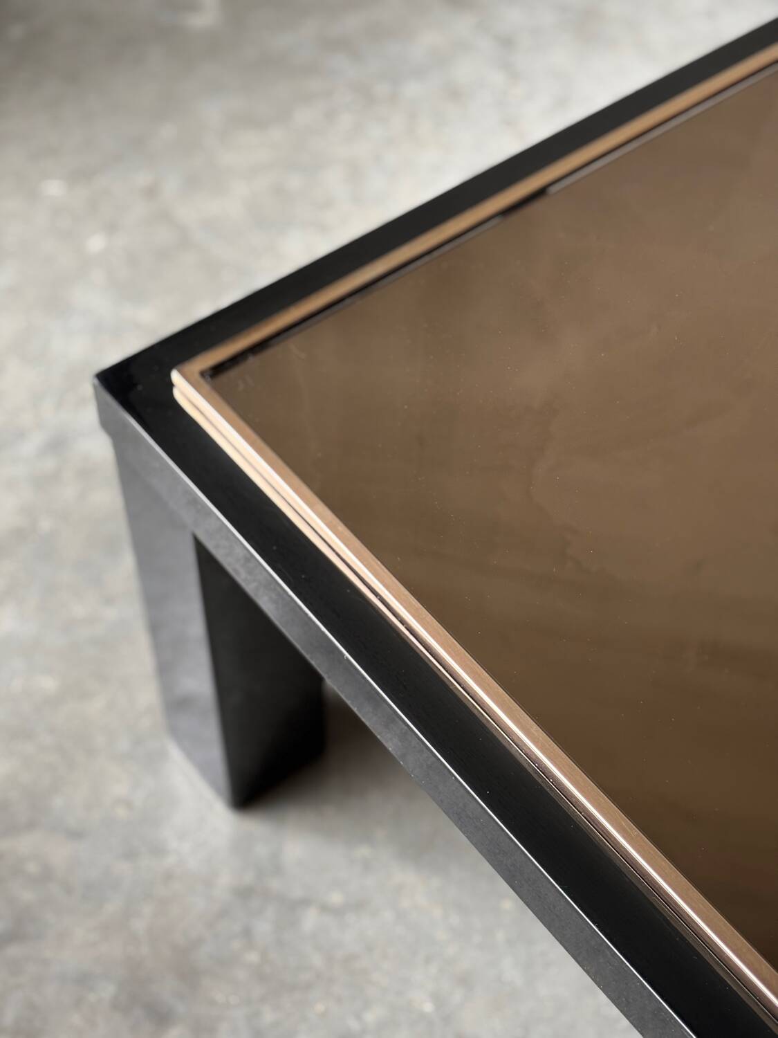 Large Belgochrom coffee table in gold and smoked glass.