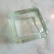 Glass tile pocket emptier