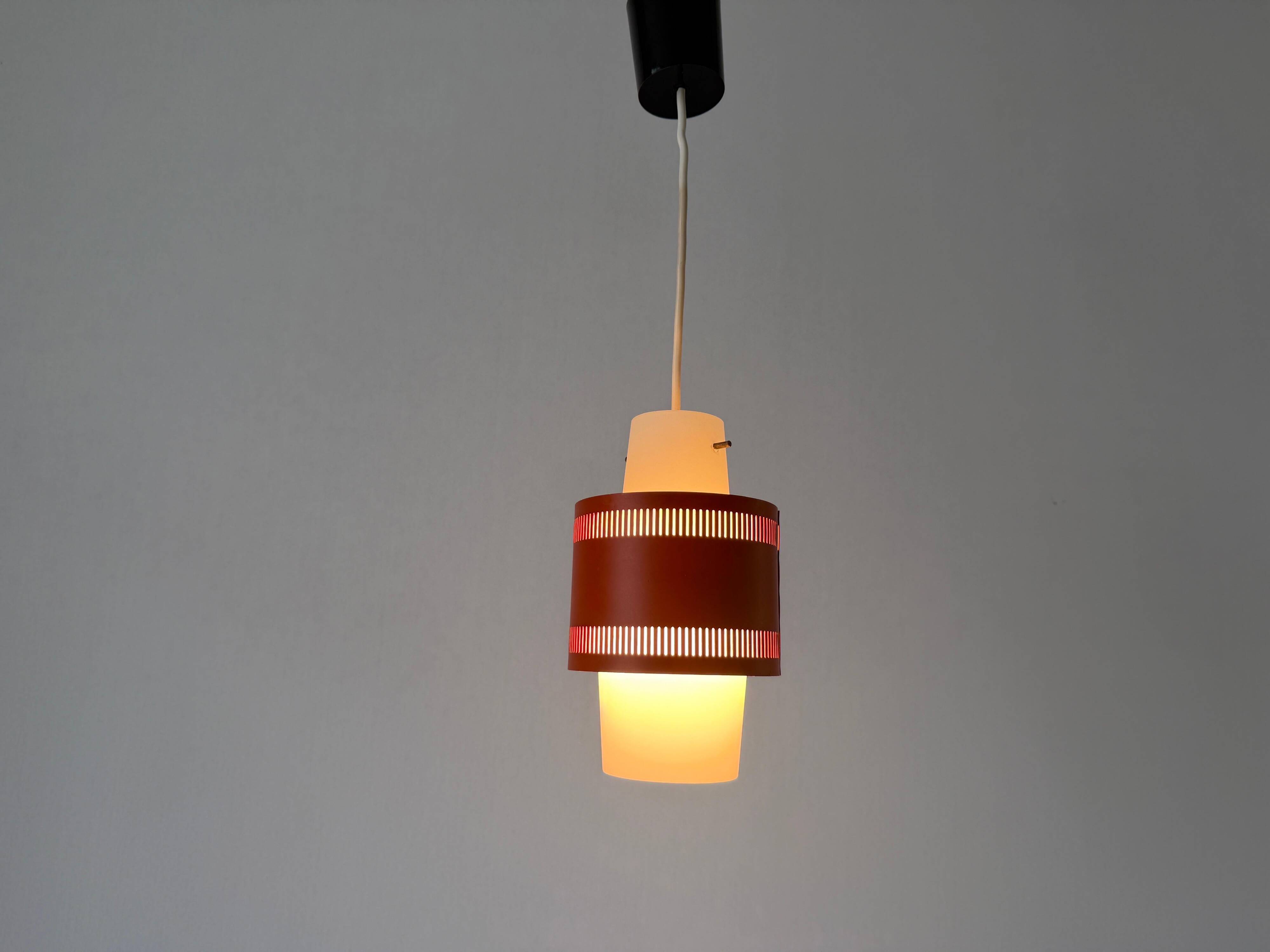 Glass ceiling light with an orange metal frame, 1960s, Germany.