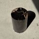 Small side table in black petrified wood with stripes and beige sides H28 D18.