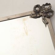 Antique mirror with silver metal rim