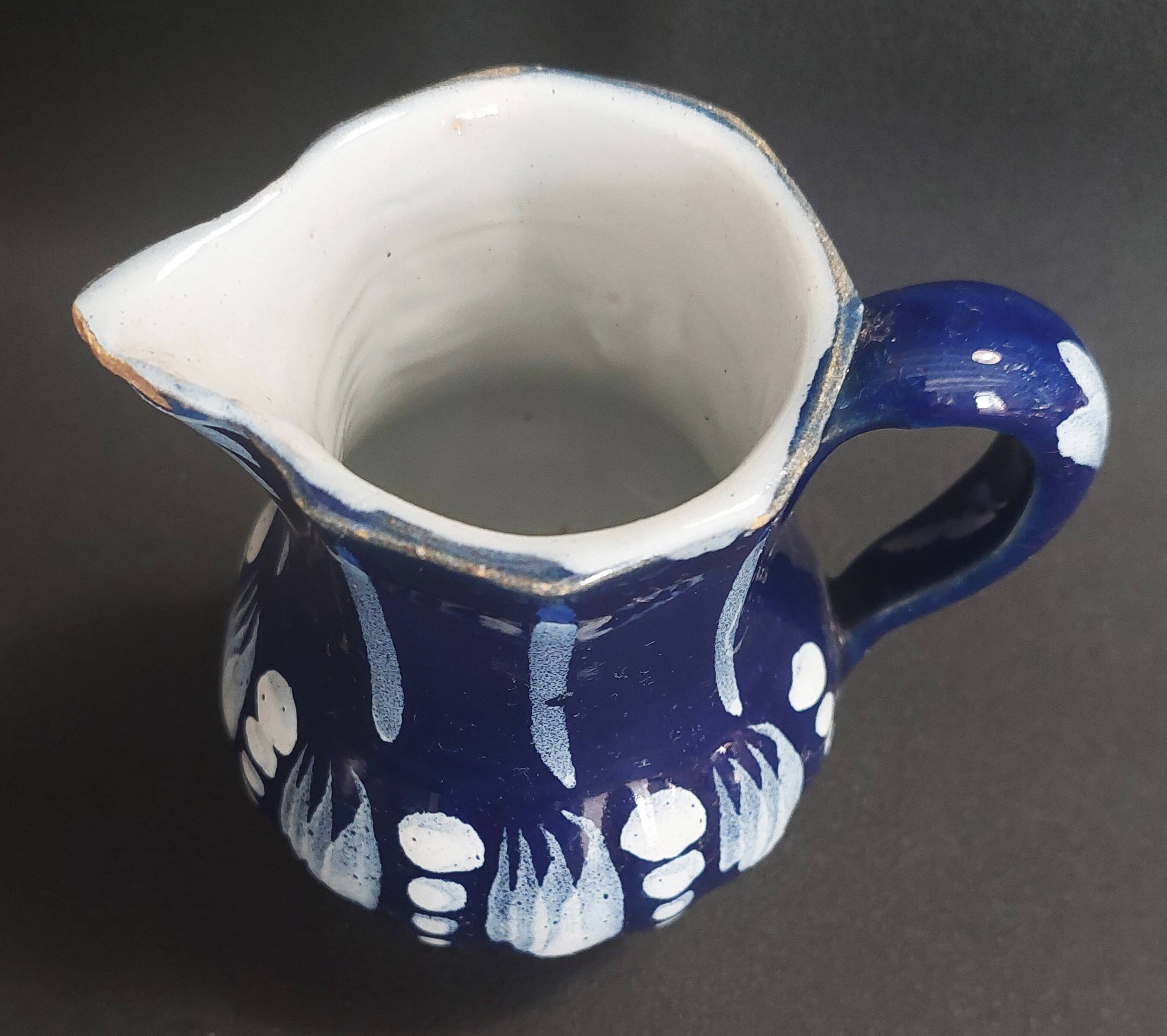 Earthenware pitcher from the North of France with blue covering, 19th century