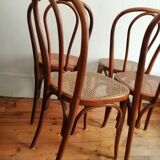 Series of 4 cane bistro chairs