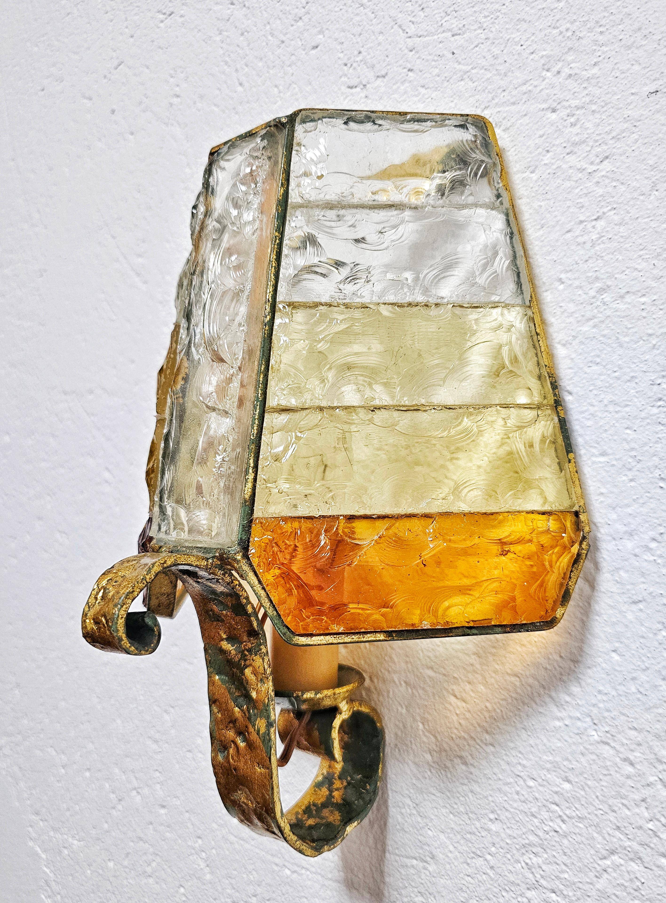 Brutalist pair of wall sconces in hammered glass by Longobard 1970.