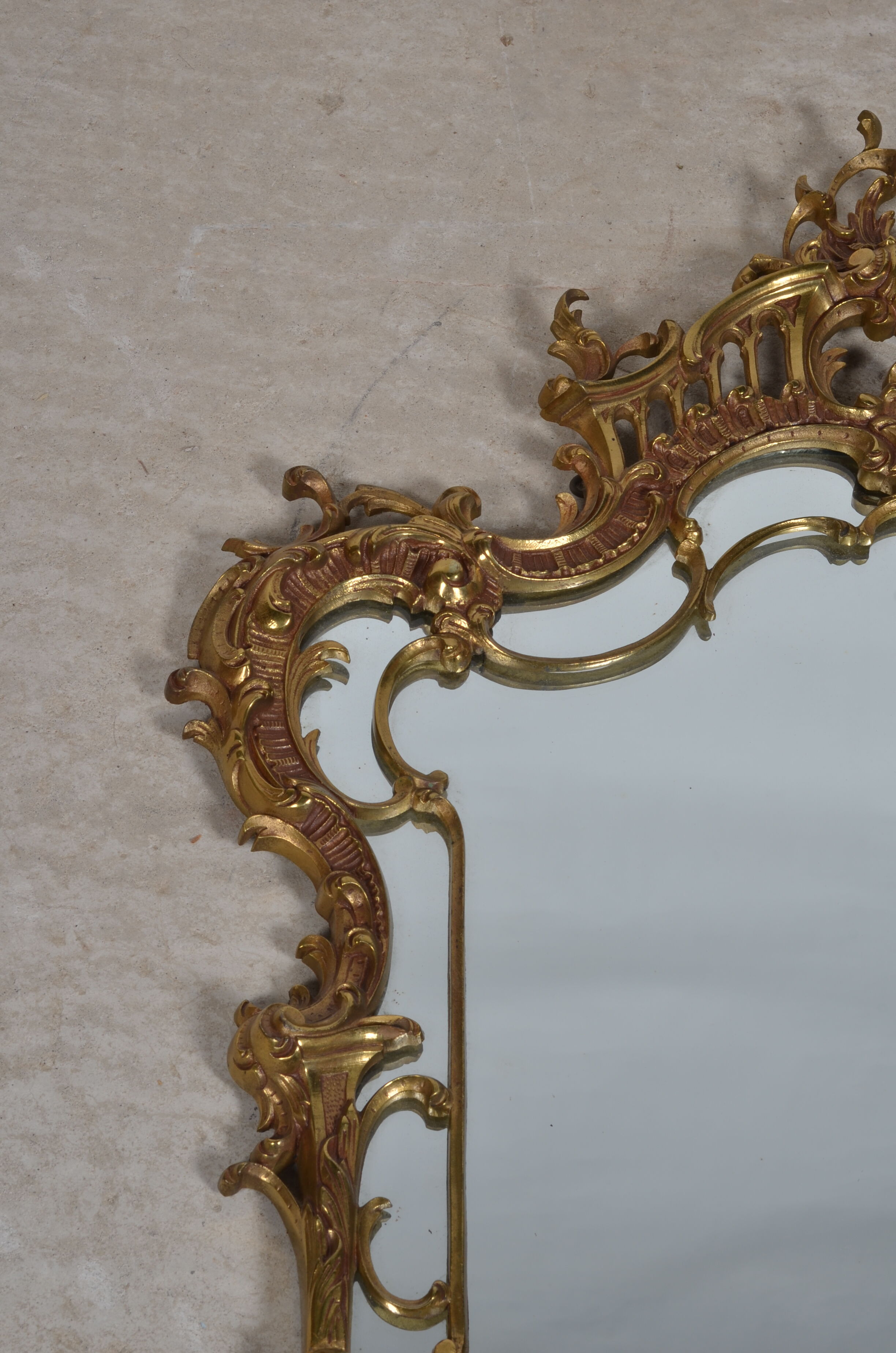 Mirror with baroque style parecloses in bronze 102 x 61 cm