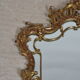 Mirror with baroque style parecloses in bronze 102 x 61 cm