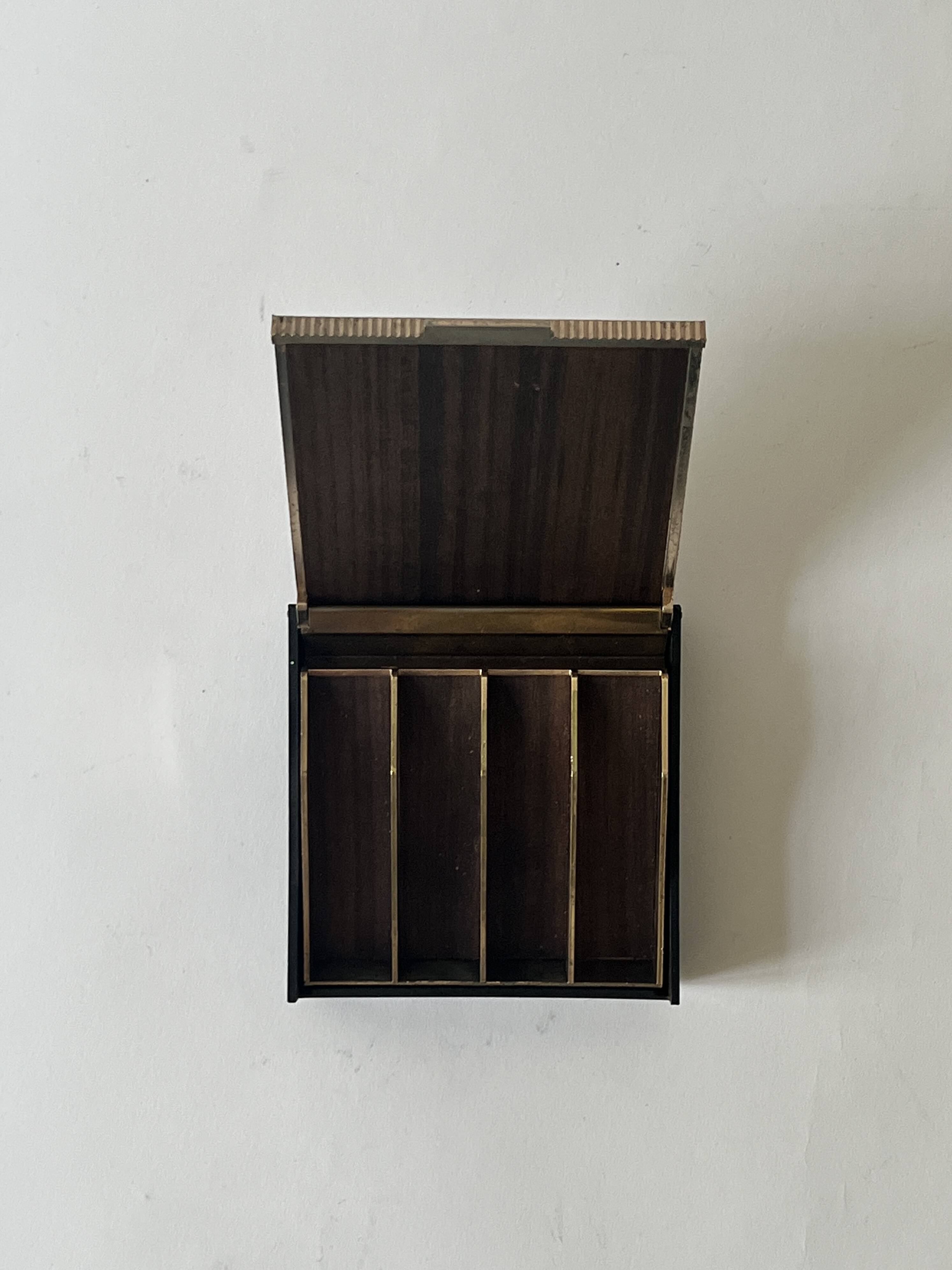 Bakelite and brass pocket emptier, 1970s design