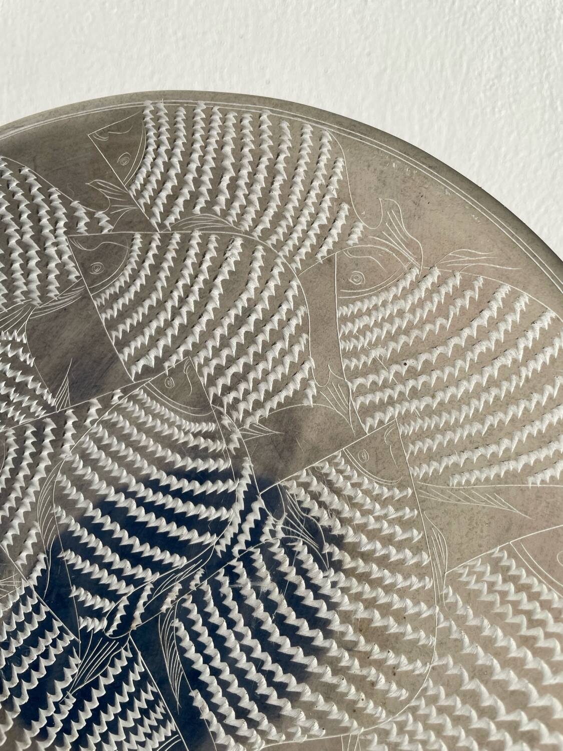 Ethnic handmade round fish dish