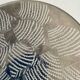 Ethnic handmade round fish dish