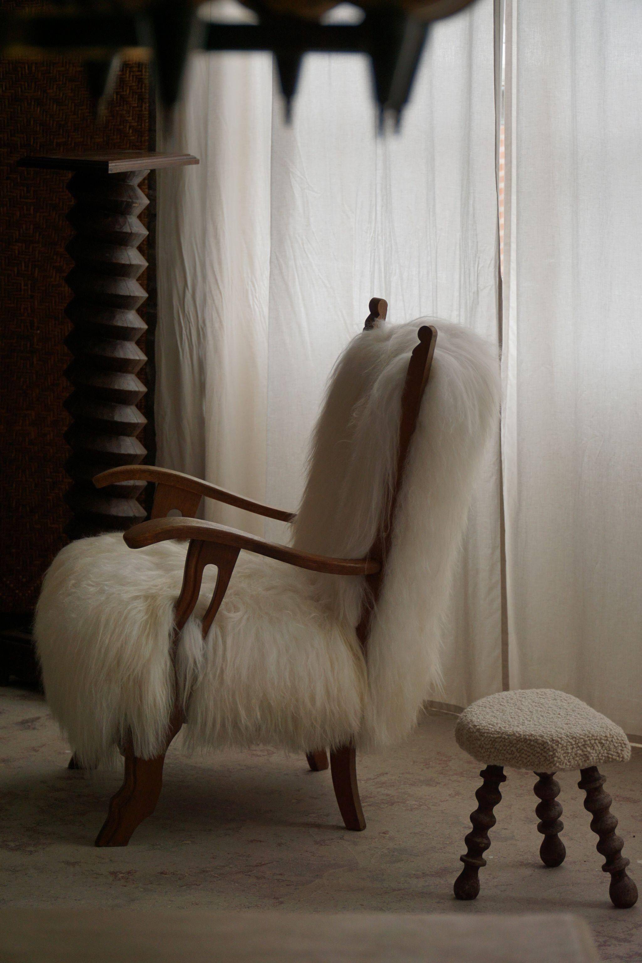 Pair of Scandinavian armchairs in oak and long-haired Icelandic sheepskin by Henning Kjærnulf, 1950.