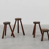 Brutalist French 1850s solid oak tripod stools with metal rim, set of 4