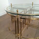 Round brass coffee table in neoclassical style