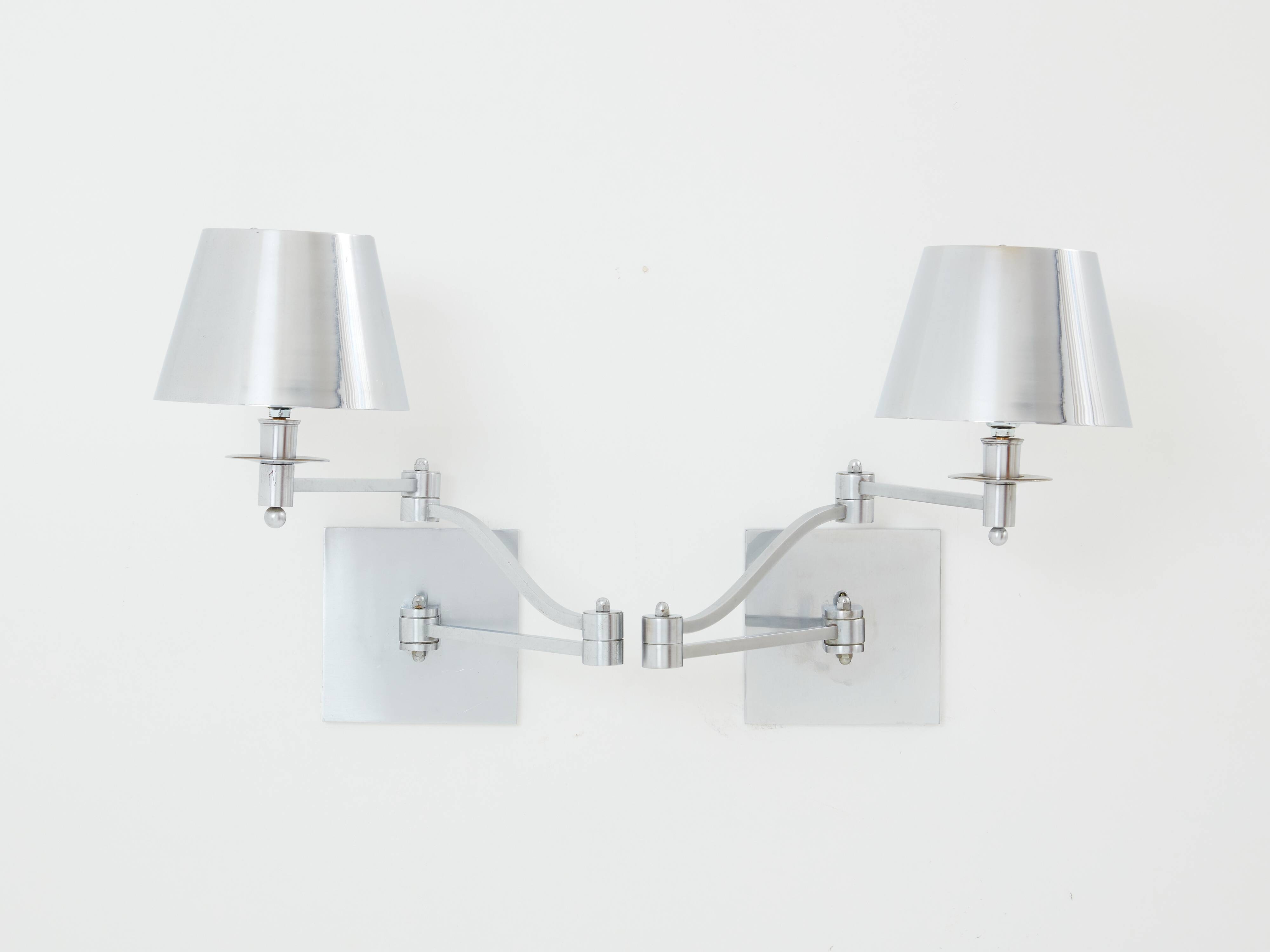 Pair of Maison Charles adjustable brushed steel wall lights circa 1960