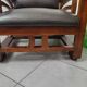 Leather and teak armchair