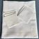 Square tablecloth (112x105cm) in wire canvas with its 6 towels