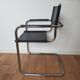Pair of armchairs in chrome and black leather