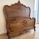 Double bed in carved wood, Louis XV style.