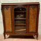 Louis XV style bookcase in mahogany and burr walnut, 20th century