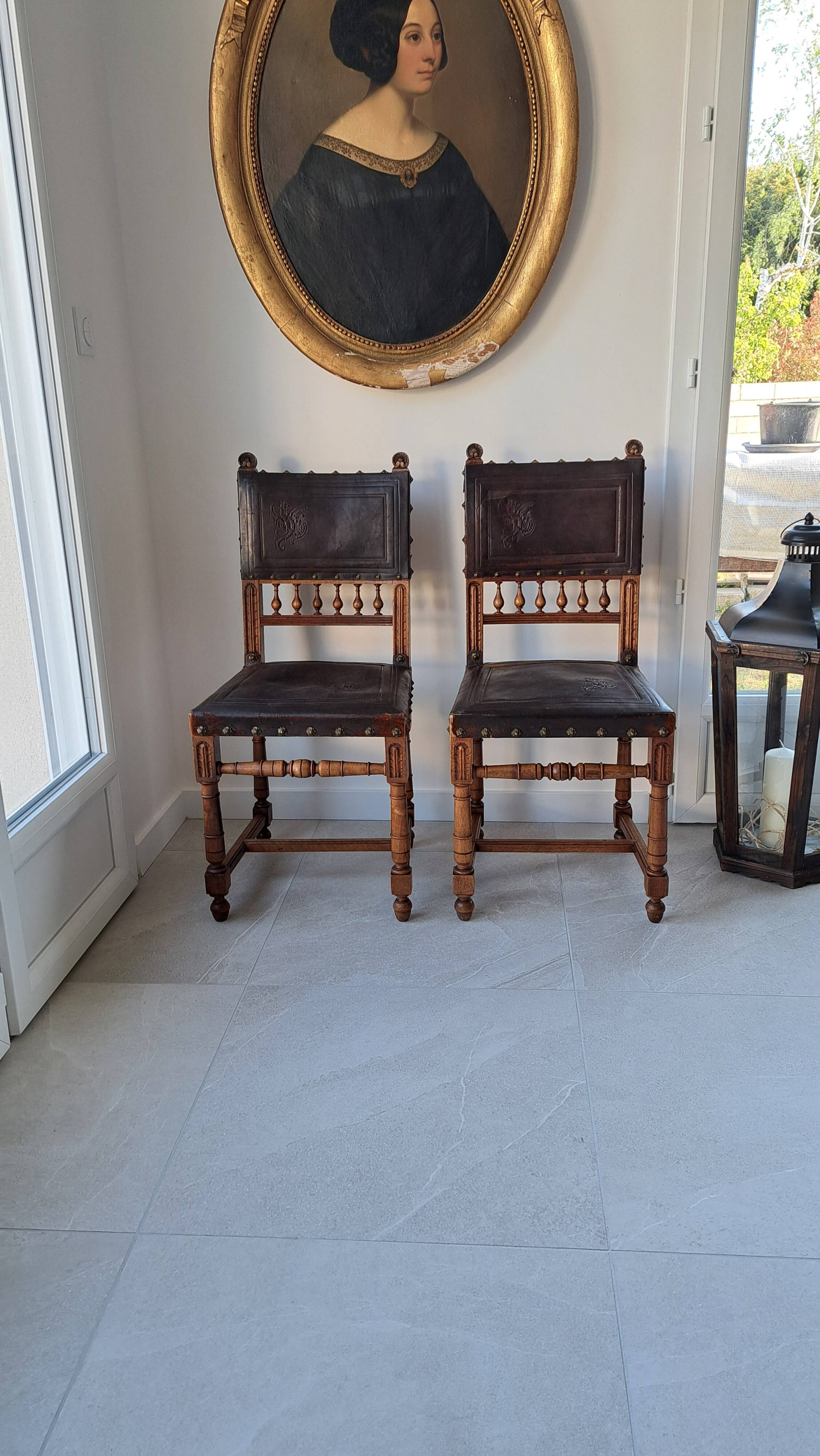 Pair of antique chairs in embossed leather, Henri II style.