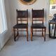 Pair of antique chairs in embossed leather, Henri II style.