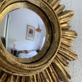 Vintage 1960s sunburst witch's eye mirror in gold - 27 cm