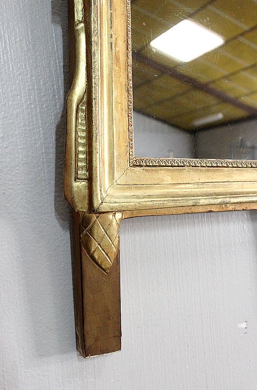Miroir en bois doré, style Louis XVl, début XXe