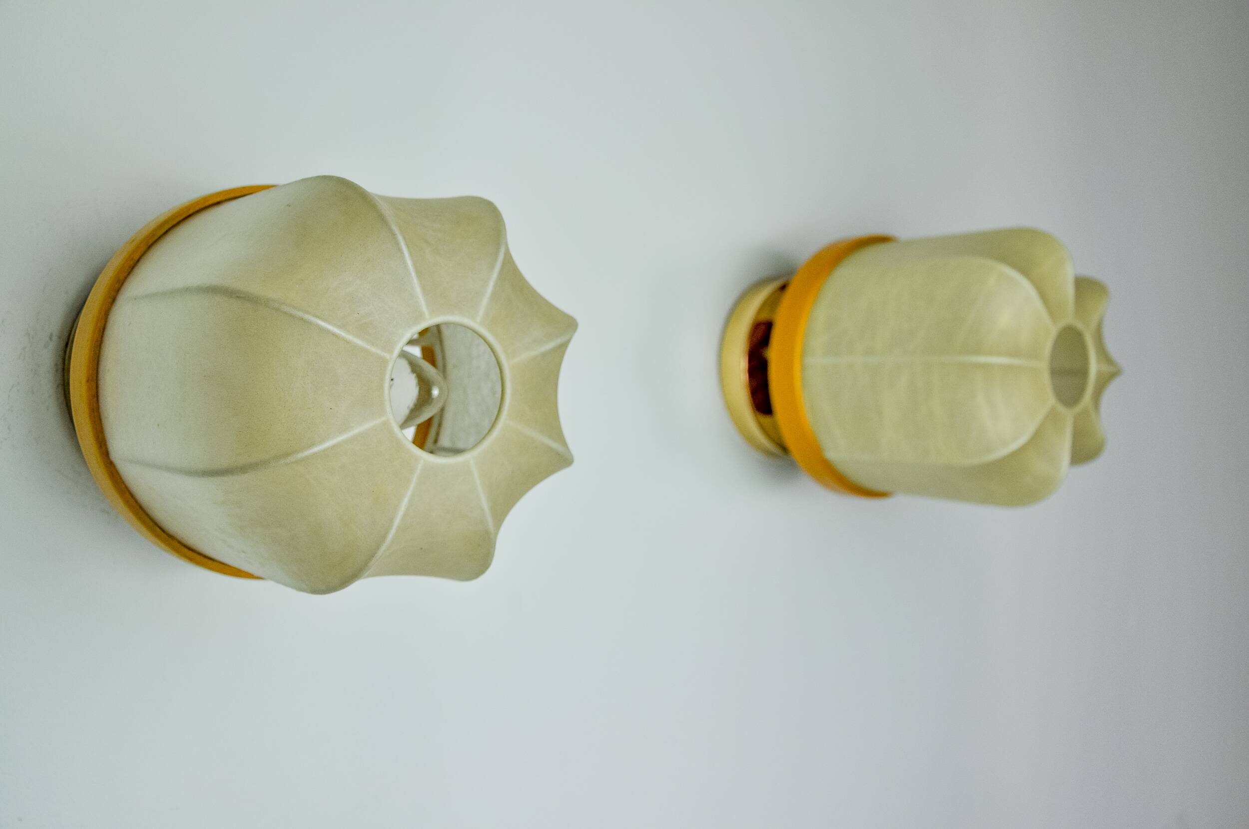 Pair of "cocoon" wall lights, resin and pine, Italy, 1970