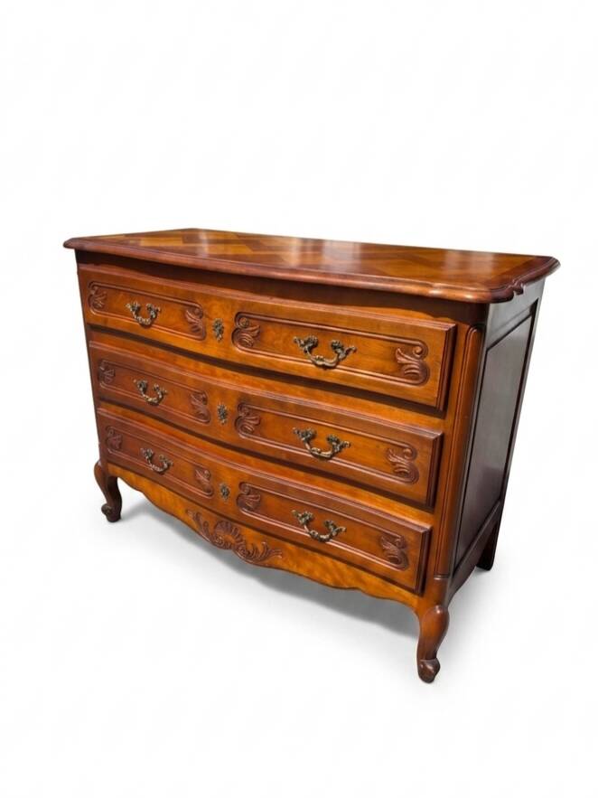 Curved commode in Louis XV style made of cherry wood.