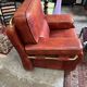 living room in patinated leather and brass from the 80s