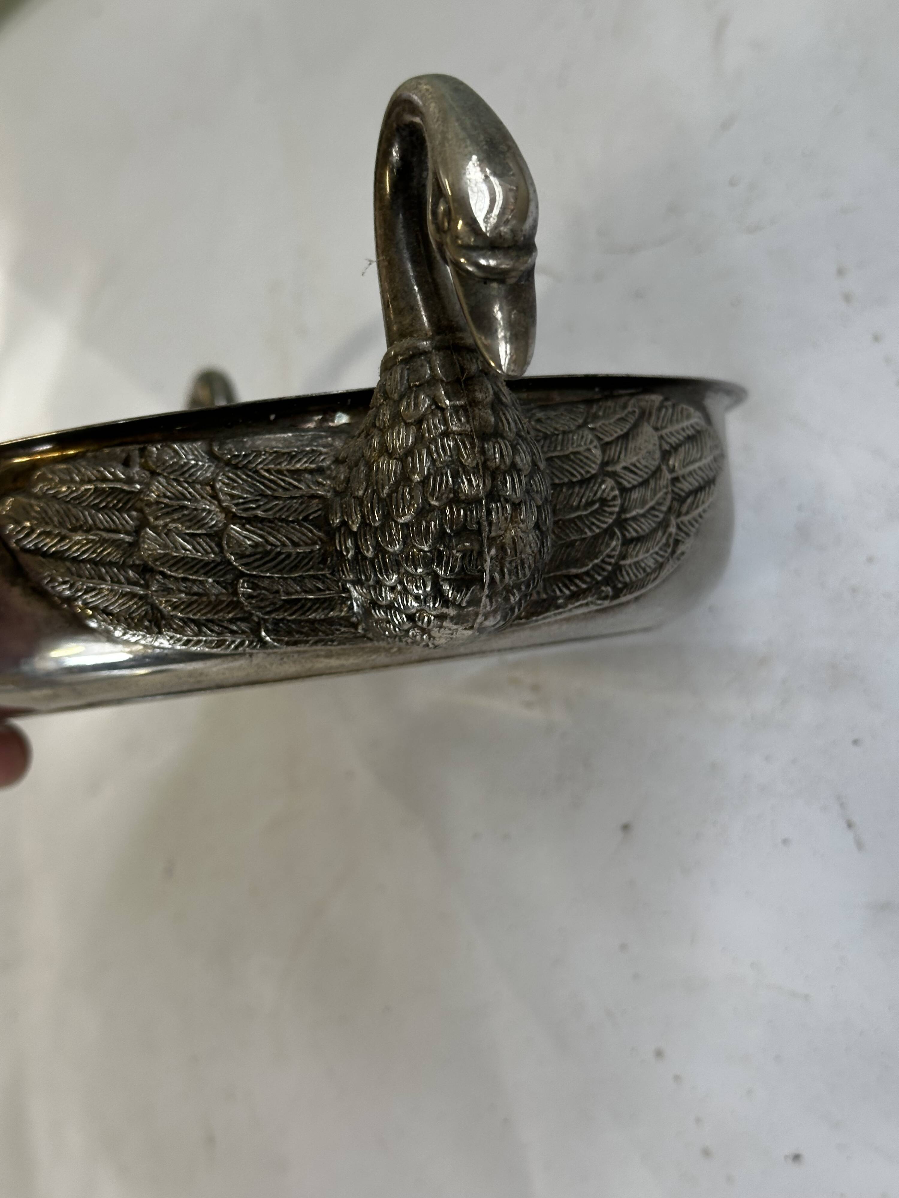Art Deco silver-plated metal pocket emptier with swan decor