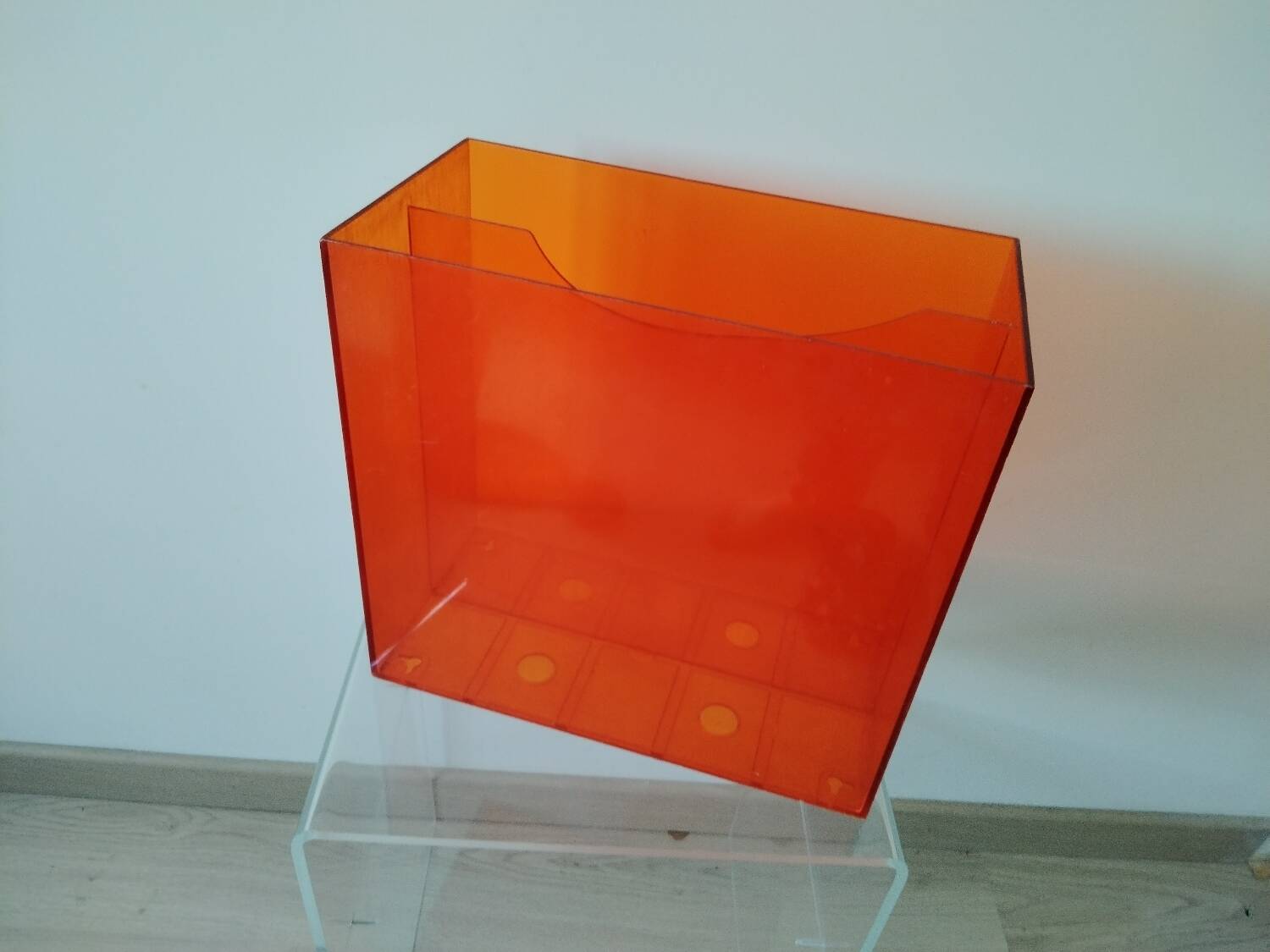 Vinyl magazine holder in orange plexiglass