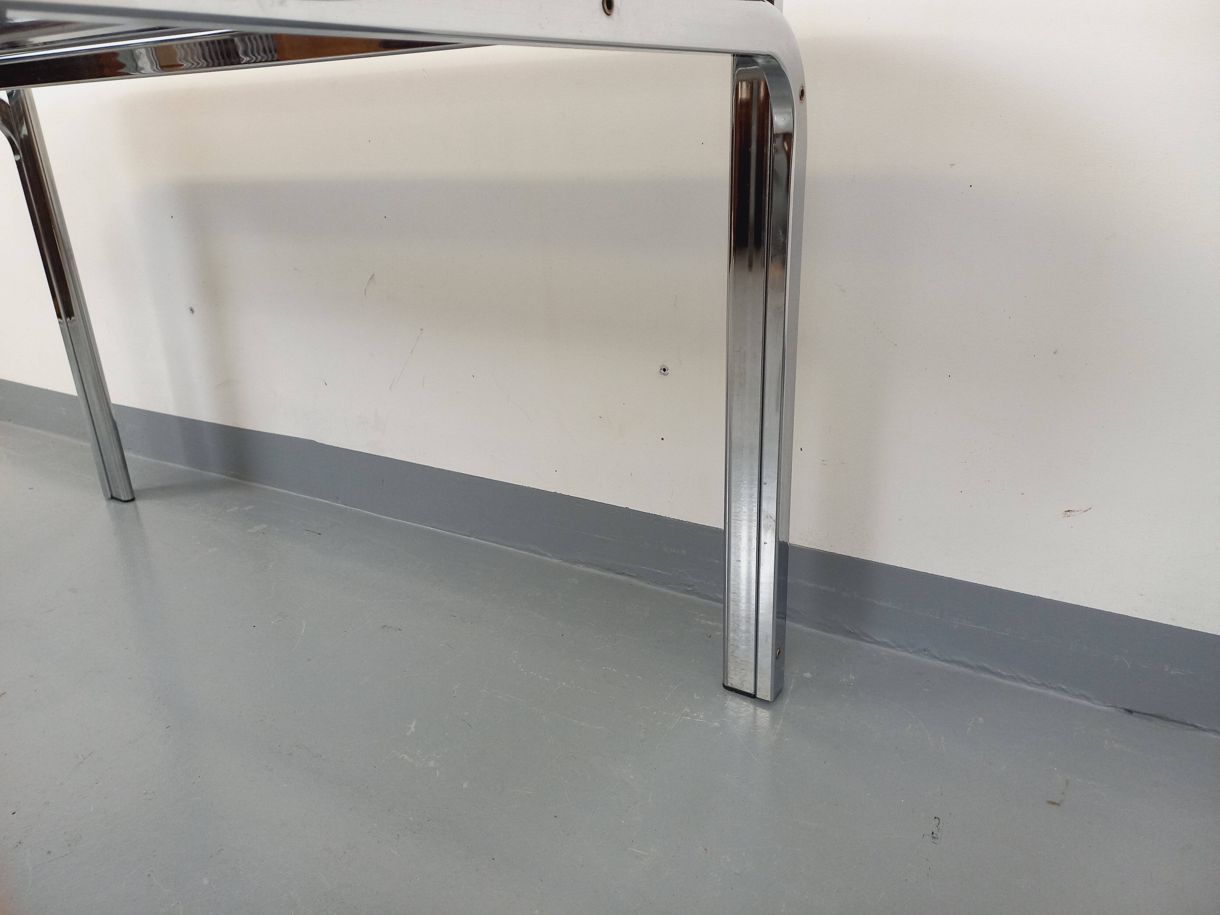 Vintage oval dining table in smoked glass and chrome metal, Space Age style.