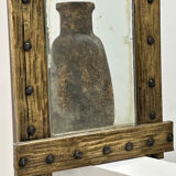 Brutalist mirror with a hammered copper and brass frame.