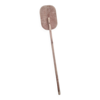 Old single wooden paddle