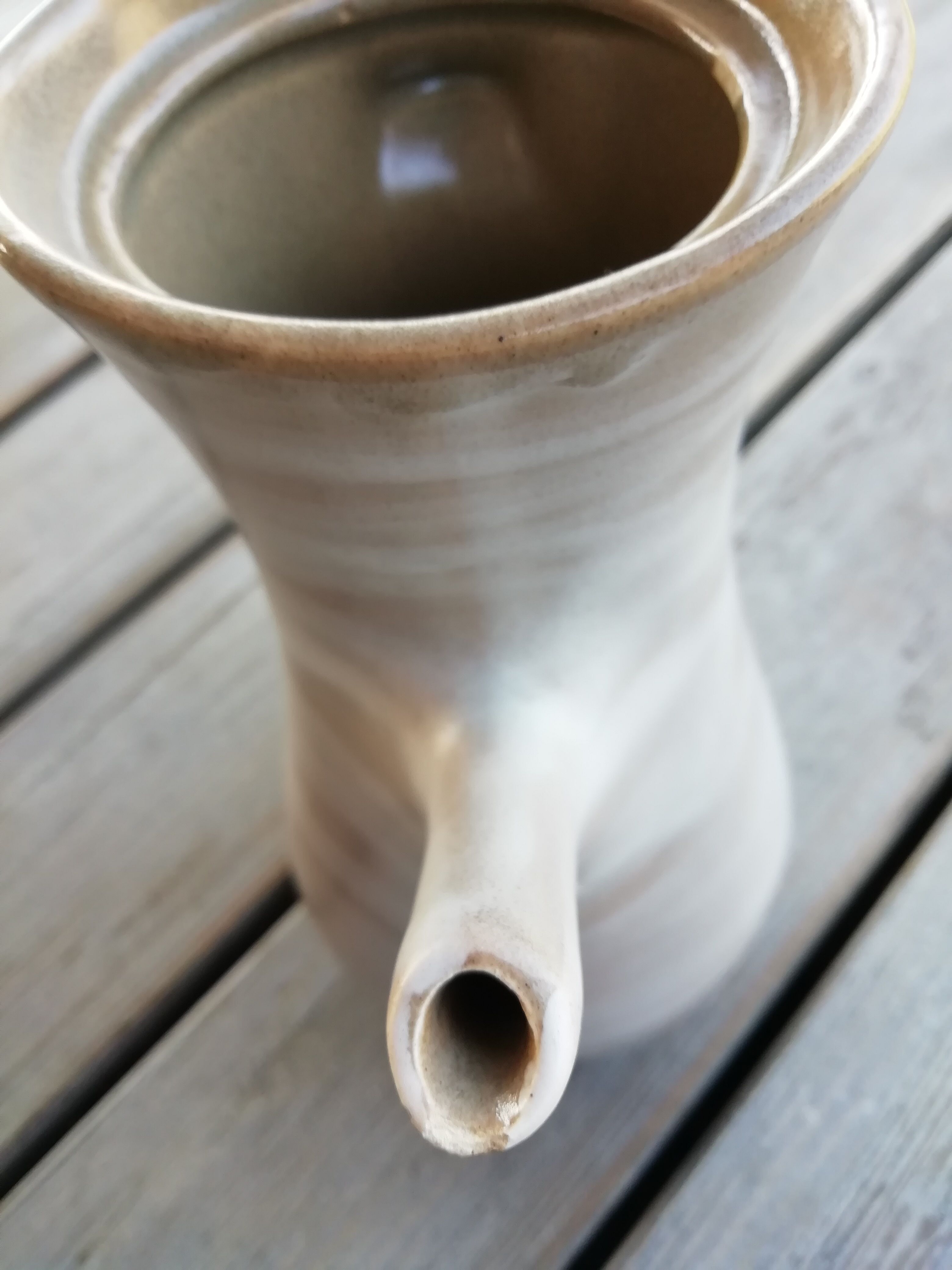 Trio of artisan sandstone teapots
