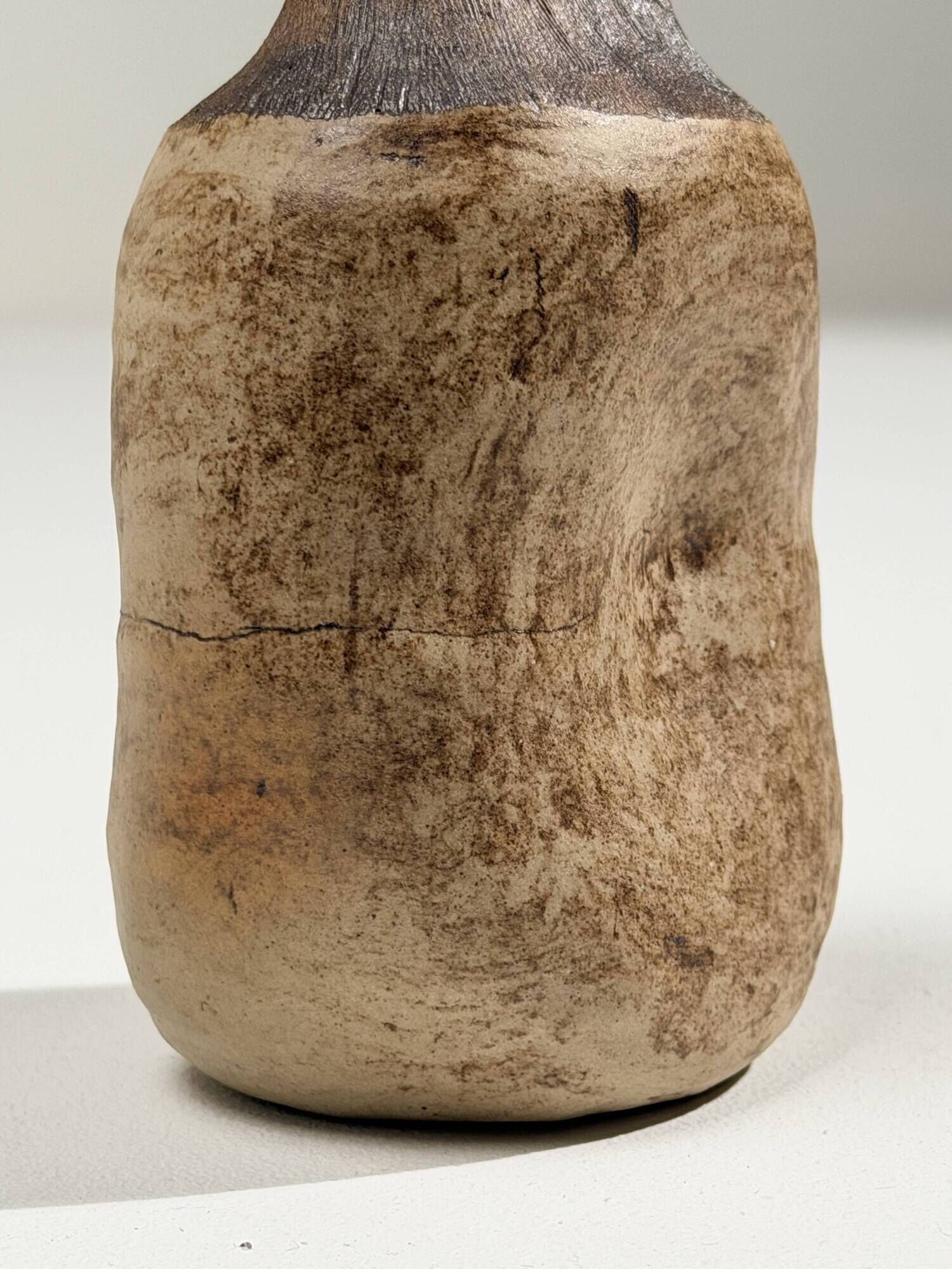 Small brutalist stoneware vase with a ribbed neck, France, circa 1960.