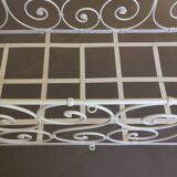 White wrought iron folding bed