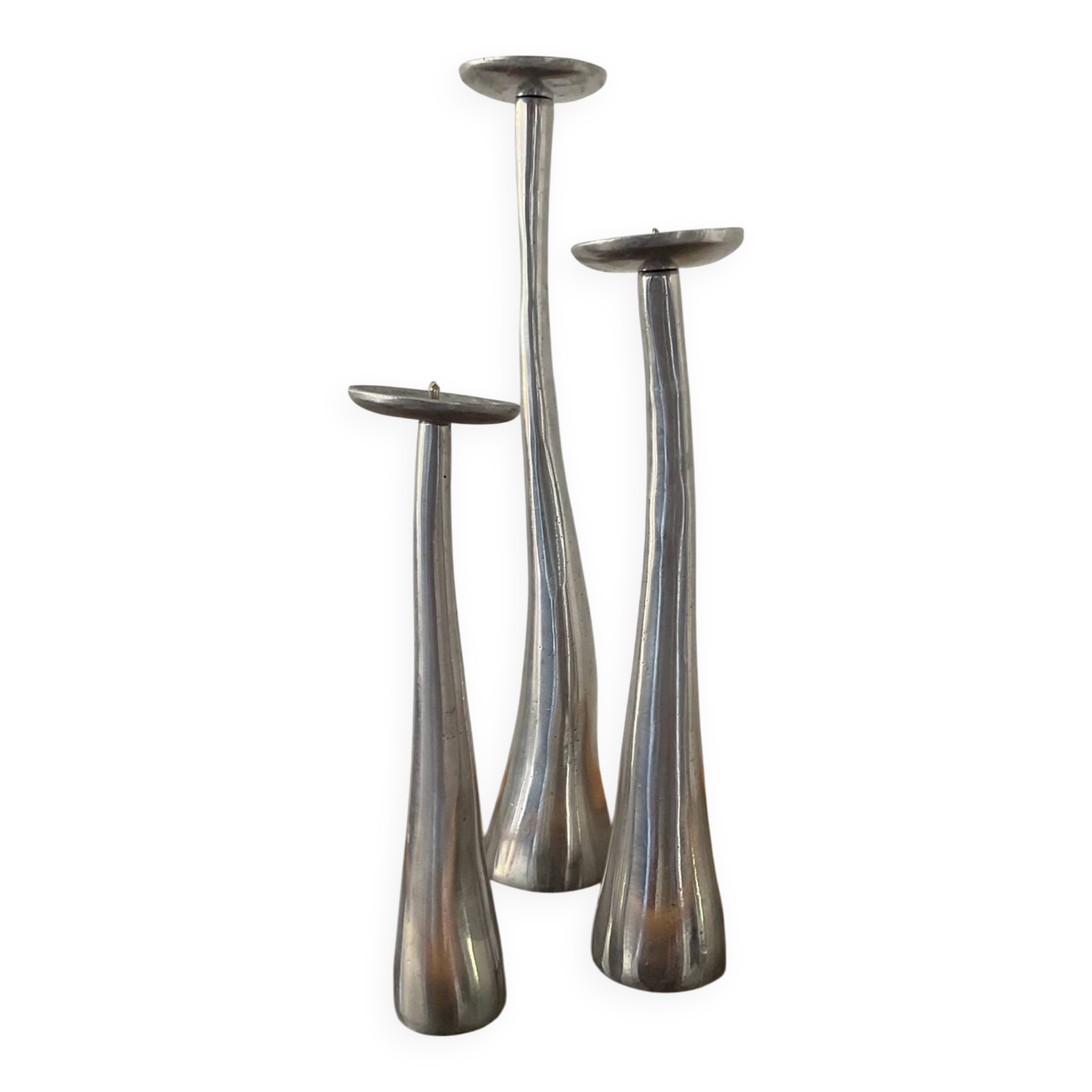 Trio of vintage cast aluminum candlesticks