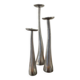 Trio of vintage cast aluminum candlesticks