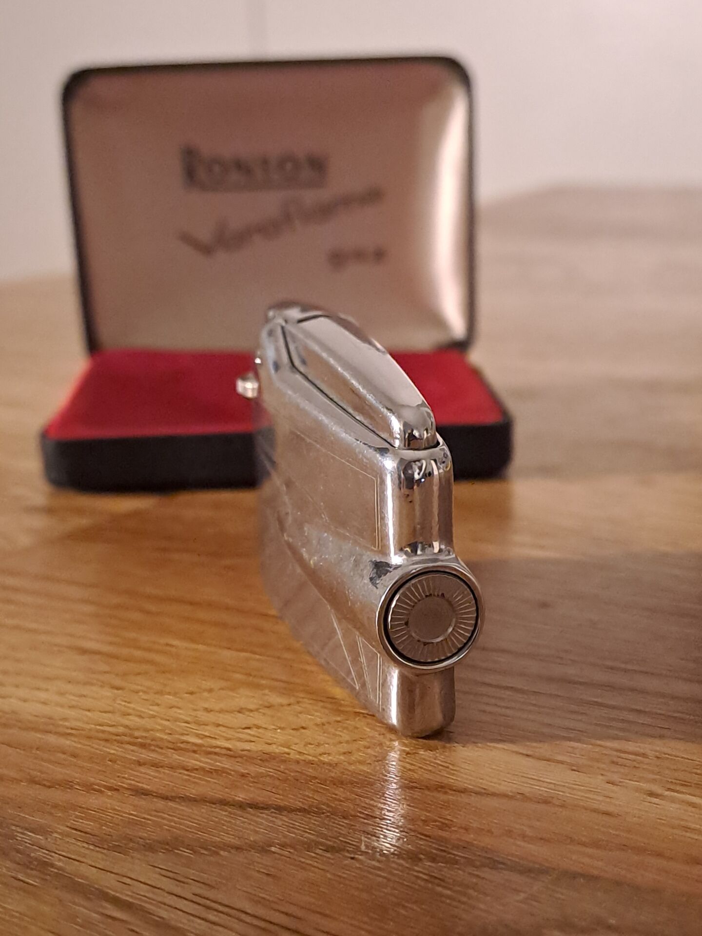 Vintage Ronson Varaflame chrome lighter and its original case.