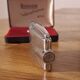 Vintage Ronson Varaflame chrome lighter and its original case.