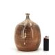 Ovoid vase with a small neck in brown beige ceramic and white drips.