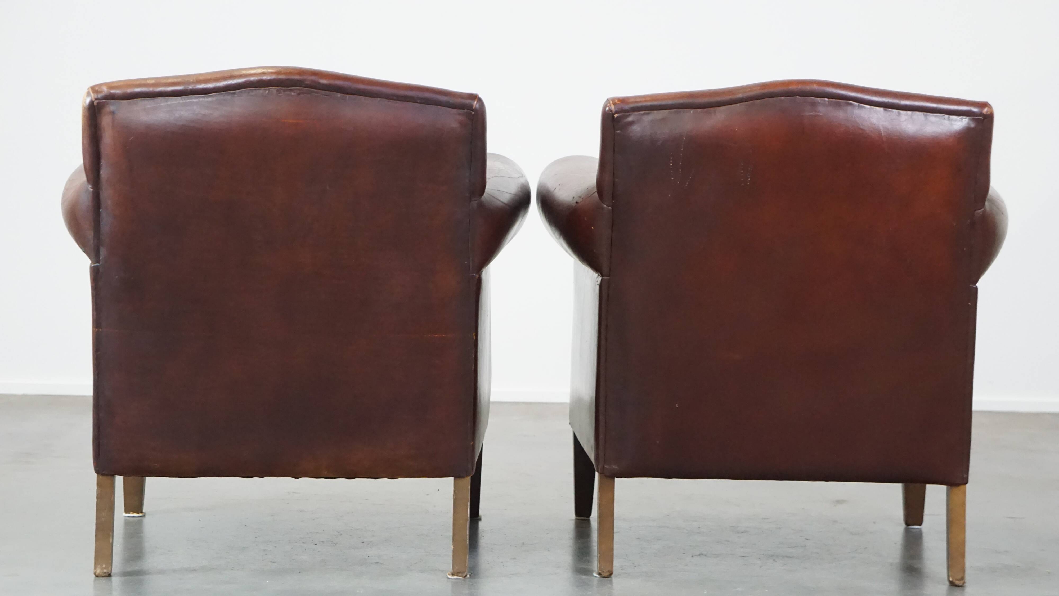 Set of 2 design armchairs made of sheepskin