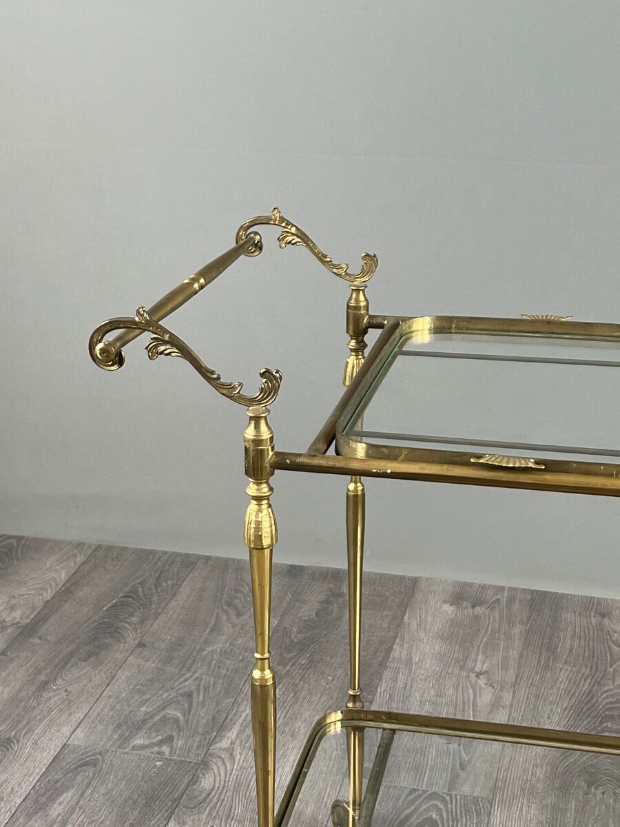 Rolling table cart in gilded brass with two glass shelves, 20th century.