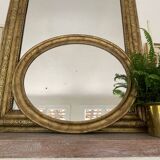 Miroir en bois doré patiné 58cm