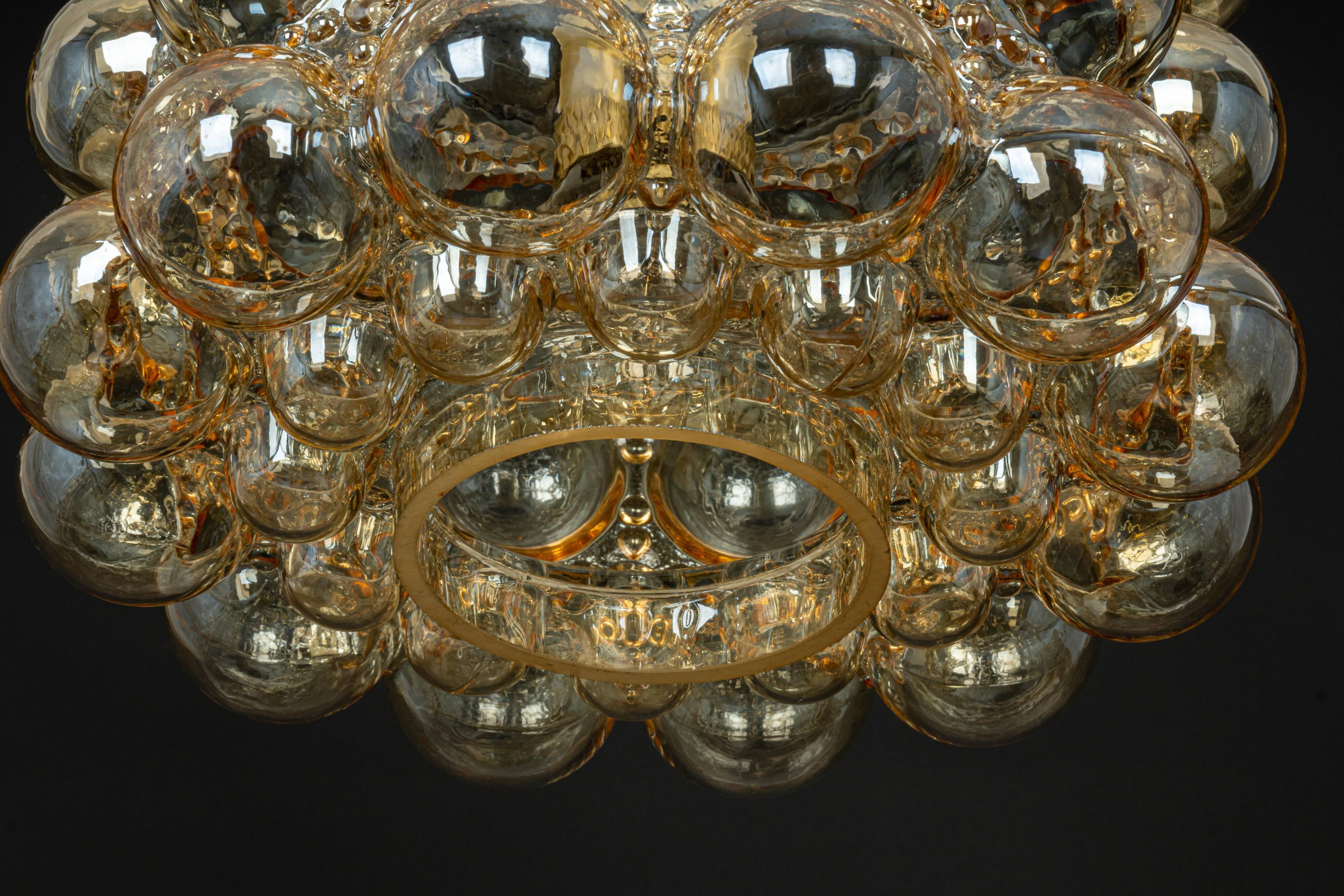 Large amber bubble glass pendant by Helena Tynell for Limburg, Germany, 1970s.